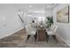 Dining area with glass table, six chairs, and a modern rug at 3026 Uxbridge Woods Ct, Charlotte, NC 28205