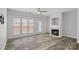 Spacious living area with hardwood floors, fireplace, and backyard access at 3026 Uxbridge Woods Ct, Charlotte, NC 28205