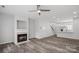 Living room with hardwood floors, fireplace, and access to kitchen at 3026 Uxbridge Woods Ct, Charlotte, NC 28205