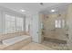 Spa-like bathroom with walk-in shower and soaking tub at 303 Hillside Ave, Charlotte, NC 28209