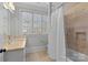 Bathroom with a shower/tub, double vanity, and window at 303 Hillside Ave, Charlotte, NC 28209