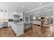 Open kitchen with island, stainless steel appliances, and Gathering room view at 303 Hillside Ave, Charlotte, NC 28209