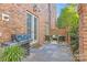 Brick patio with seating area, grill, and French doors at 303 Hillside Ave, Charlotte, NC 28209