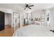 Well-lit bedroom with hardwood floors and a full-length mirror at 303 S Greene St, Wadesboro, NC 28170