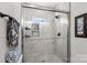 Large walk-in shower with marble tile and built-in shelving at 303 S Greene St, Wadesboro, NC 28170