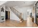 Elegant staircase with modern metal railing and hardwood treads at 303 S Greene St, Wadesboro, NC 28170