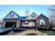 Brick and beige two-story house with attached garage and landscaping at 306 Bluegill Ln, Statesville, NC 28625