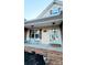 Inviting front porch with light blue door, two chairs, and a welcoming atmosphere at 306 Bluegill Ln, Statesville, NC 28625