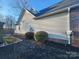 Side view of the house showcasing landscaping and exterior features at 306 Bluegill Ln, Statesville, NC 28625