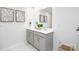 A well-lit bathroom featuring double sink vanity and framed art at 3148 Ora Smith Rd, Lincolnton, NC 28092