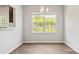 Bright dining area with window and chandelier at 3148 Ora Smith Rd, Lincolnton, NC 28092