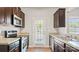 Kitchen with stainless steel appliances and dark cabinets at 3148 Ora Smith Rd, Lincolnton, NC 28092