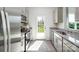 A modern kitchen featuring granite countertops, stainless steel appliances, and a view of the backyard at 3148 Ora Smith Rd, Lincolnton, NC 28092