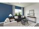 Cozy living room featuring a dark sofa, light-colored armchairs, and a neutral area rug at 3148 Ora Smith Rd, Lincolnton, NC 28092