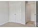 Well-lit bedroom with double door closet and neutral carpeting at 3156 Ora Smith Rd, Lincolnton, NC 28092