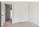 Spacious bedroom with double-door closet and access to a hallway at 3156 Ora Smith Rd, Lincolnton, NC 28092