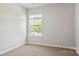 Bright bedroom featuring neutral walls, carpeted floors, and a window at 3156 Ora Smith Rd, Lincolnton, NC 28092