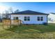 Backyard view of house with deck and large grassy area at 335 Pinewood Ln, Rock Hill, SC 29730