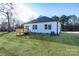 Backyard view of house with deck and large grassy area at 335 Pinewood Ln, Rock Hill, SC 29730