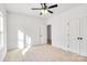 Well-lit bedroom featuring a ceiling fan and closet at 335 Pinewood Ln, Rock Hill, SC 29730