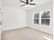 Spacious bedroom with two windows and ceiling fan at 335 Pinewood Ln, Rock Hill, SC 29730