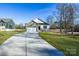 House exterior with a driveway and landscaping at 335 Pinewood Ln, Rock Hill, SC 29730