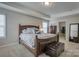 Spacious primary bedroom with large bed, walk-in closet, and natural light at 3836 Lake Breeze Dr, Sherrills Ford, NC 28673