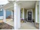 Front porch with white columns and welcoming decor at 3836 Lake Breeze Dr, Sherrills Ford, NC 28673