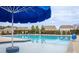 Community pool with blue umbrella, plenty of space for relaxing at 3836 Lake Breeze Dr, Sherrills Ford, NC 28673