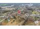 Aerial view of a quiet neighborhood with tree-lined streets and cozy homes at 407 Thomas St, Marshville, NC 28103