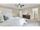 Bright bedroom with a modern dresser, soft carpet, a closet, and an en-suite bathroom at 407 Thomas St, Marshville, NC 28103