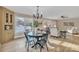 Cozy dining area with a stylish table and chairs, hardwood floors, and natural light at 407 Thomas St, Marshville, NC 28103