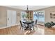 Inviting dining room featuring a classic chandelier, hardwood floors, and ample seating at 407 Thomas St, Marshville, NC 28103