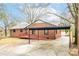 Features a spacious carport and a ramp for accessibility at 407 Thomas St, Marshville, NC 28103