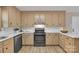 Well-lit kitchen with stainless steel appliances, ample cabinet space, and modern countertops at 407 Thomas St, Marshville, NC 28103