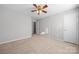 Well-lit bedroom with ceiling fan and neutral decor at 4210 Saguaro Ct, Charlotte, NC 28269