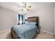 Serene bedroom with a comfortable bed and window coverings at 4210 Saguaro Ct, Charlotte, NC 28269