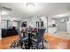 Bright dining room with a glass table, four chairs, and kitchen views at 4210 Saguaro Ct, Charlotte, NC 28269