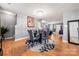 Bright dining room features a glass table with four chairs and a decorative rug at 4210 Saguaro Ct, Charlotte, NC 28269