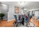 Bright dining room features a glass table with four chairs and a decorative rug at 4210 Saguaro Ct, Charlotte, NC 28269