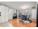 Bright dining room features a glass table with four chairs and a decorative rug at 4210 Saguaro Ct, Charlotte, NC 28269