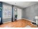 Light and airy entryway with gray walls and wood floors at 4210 Saguaro Ct, Charlotte, NC 28269