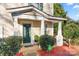 Inviting front porch with green door and landscaping at 4210 Saguaro Ct, Charlotte, NC 28269