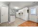 White kitchen with granite countertops and stainless steel appliances at 4210 Saguaro Ct, Charlotte, NC 28269