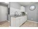 Modern kitchen featuring granite countertops and white cabinetry at 4210 Saguaro Ct, Charlotte, NC 28269