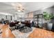 Spacious living room with gray walls, wood floors, and comfortable seating at 4210 Saguaro Ct, Charlotte, NC 28269