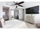 Spacious bedroom with large TV, dresser, and ensuite bathroom at 4620 Piedmont Row Dr # 504, Charlotte, NC 28210