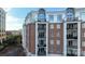 Brick building with multiple balconies and city views at 4620 Piedmont Row Dr # 504, Charlotte, NC 28210