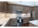 Modern kitchen with stainless steel appliances and expansive countertops at 4620 Piedmont Row Dr # 504, Charlotte, NC 28210