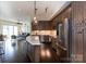 Modern kitchen with stainless steel appliances and a large island at 4620 Piedmont Row Dr # 504, Charlotte, NC 28210